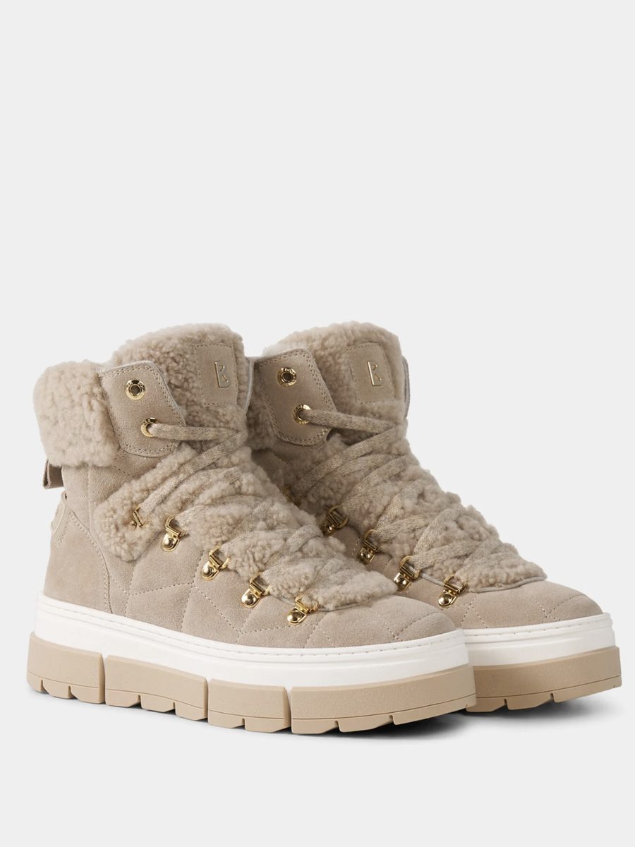 Bottes à lacets en daim beige à revers bouclette, crochets dorés et semelle crantée